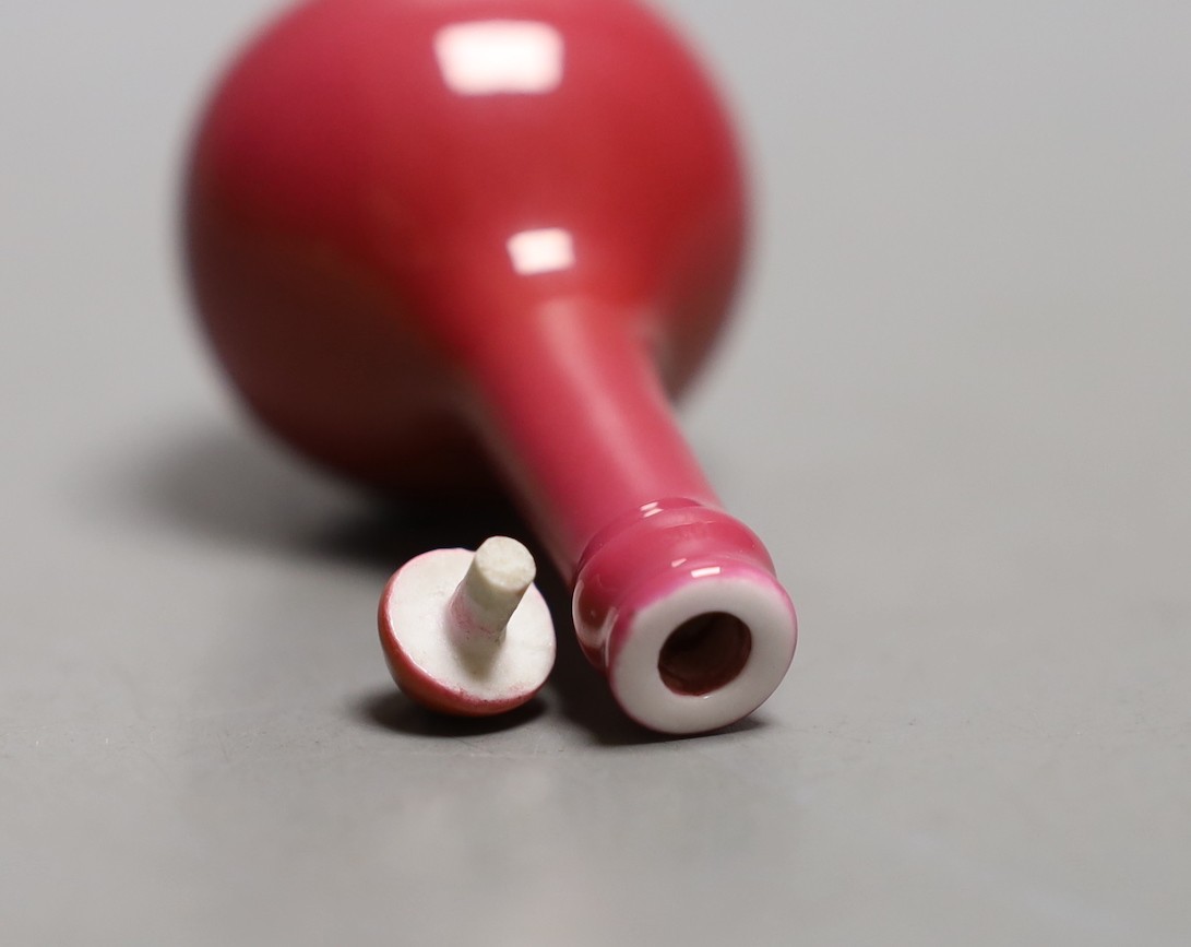A Chinese ruby ground snuff bottle and stopper, Yongzheng mark but 19th century - 8cm tall